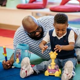 Access to innovative family services like job training, couples counseling, parenting classes, GED preparation, and more. Father with boy